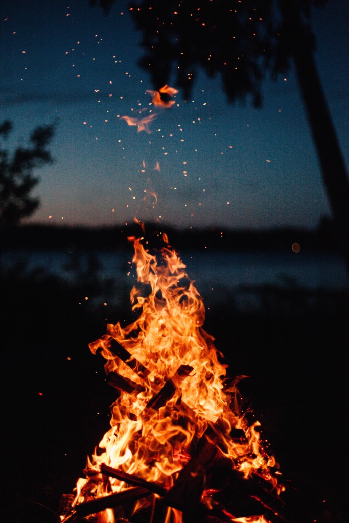 A bonfire with a late summer night sky