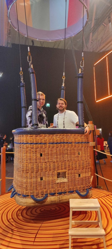 Two Brigtlife team members inside a hot-air balloon at the Slush event.