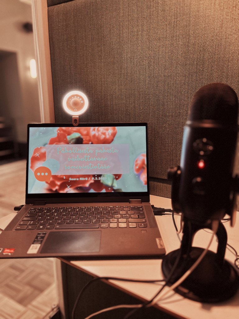 A laptop and a podcast microphone.