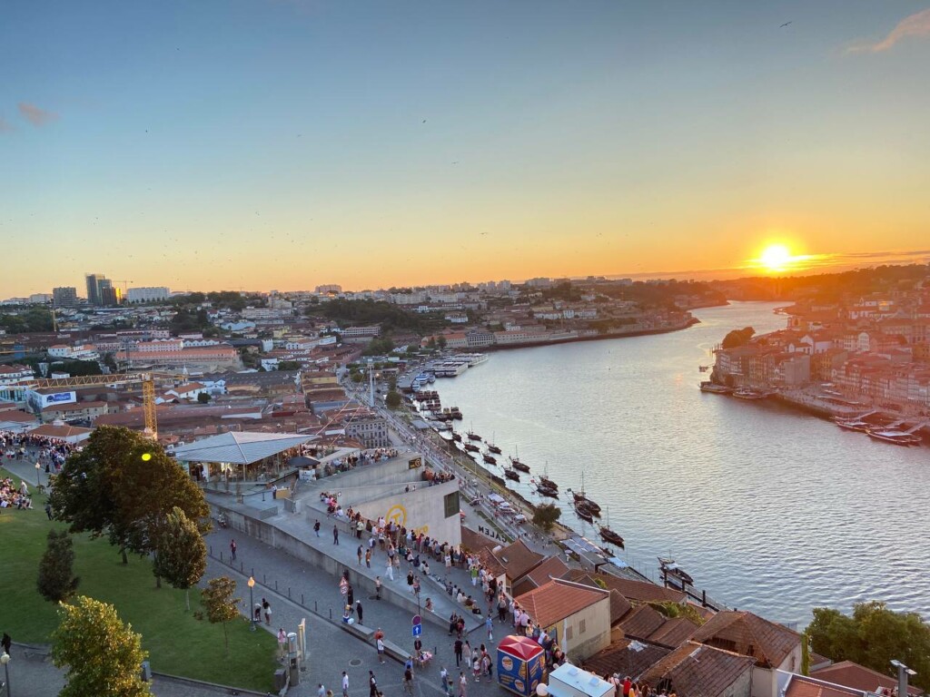 Scenic view of Porto with a sun setting at the horizon.