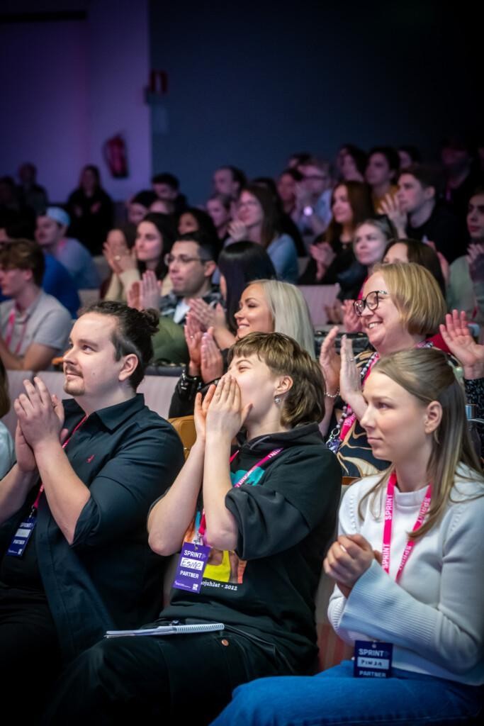 Person from an audience cheering.